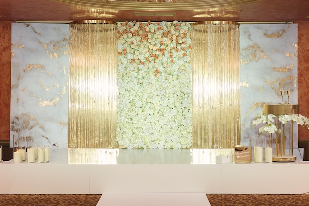 An arch for a wedding ceremony in a restaurant.