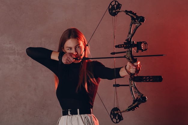 Archer woman with sport bow and arrow