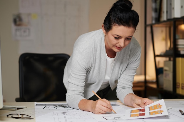 Architect Double Checking House Plan