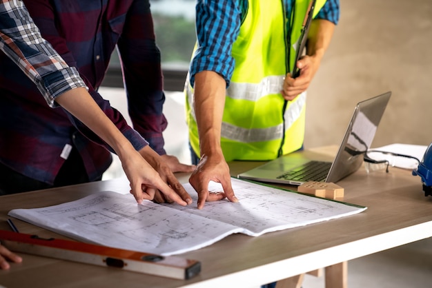 Architect and engineer checking documents