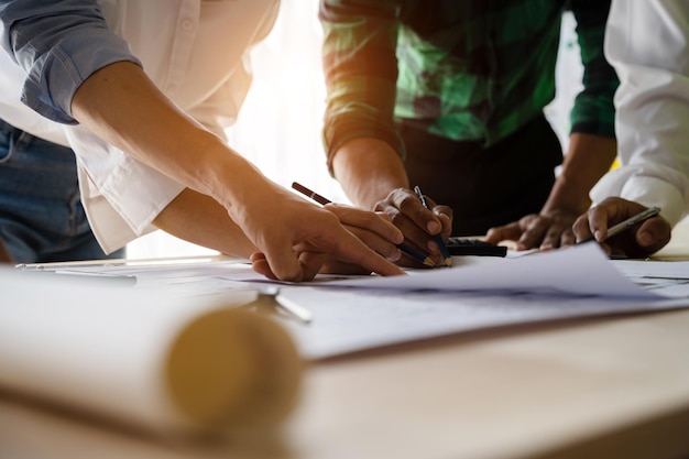 Architect or engineer team working on table use drawing tool on the paper plan for business architectural project