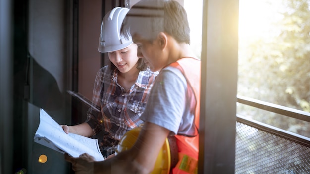 Architect & Engineer working drawing document about project plan and progress