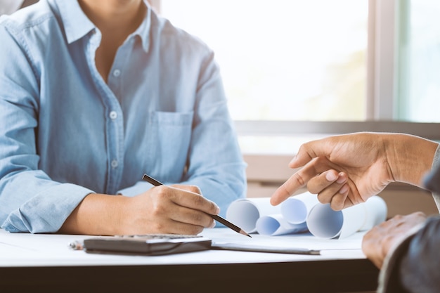 Architect female working in office with businessperson together