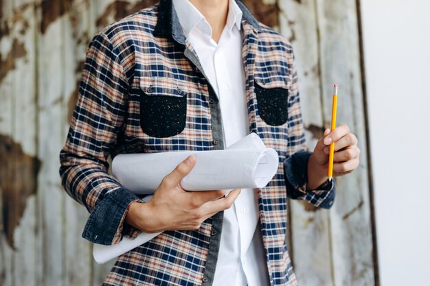 Architect holding personal architectural drawing