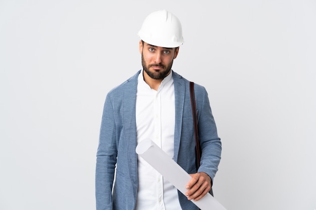 Architect man holding blueprints in studio