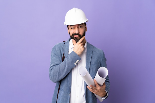 Architect man over isolated wall