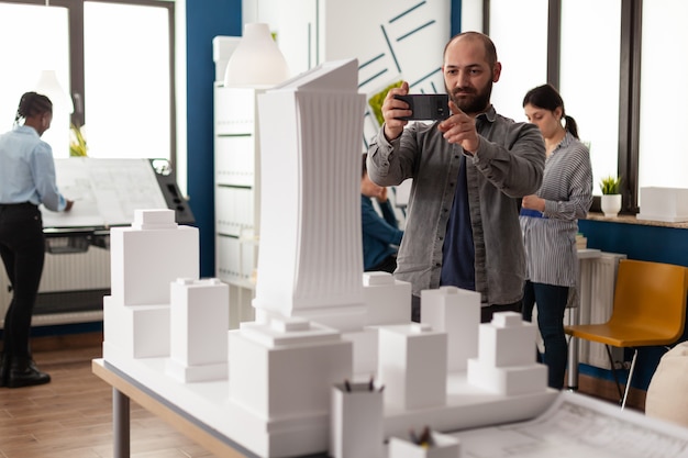 Architect profession man looking at maquette layout