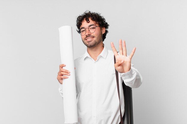 Architect smiling and looking friendly, showing number four or fourth with hand forward, counting down