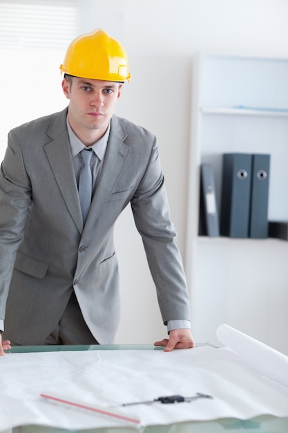 Architect with helmet on standing