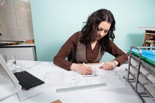 Architect woman at her working desk. Business and creativity. Architecture job