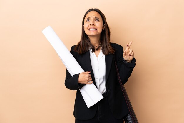 Architect woman holding blueprints