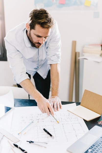 Architect working on construction plan