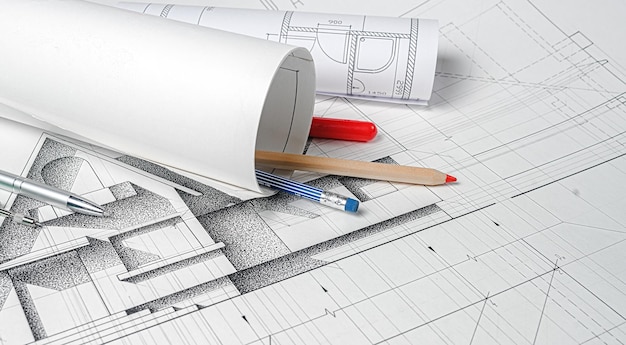 Architect workplace Rolls of architecture blueprints and house plans