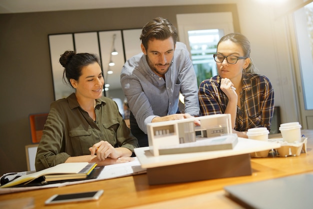 Architects looking over project for modern house 