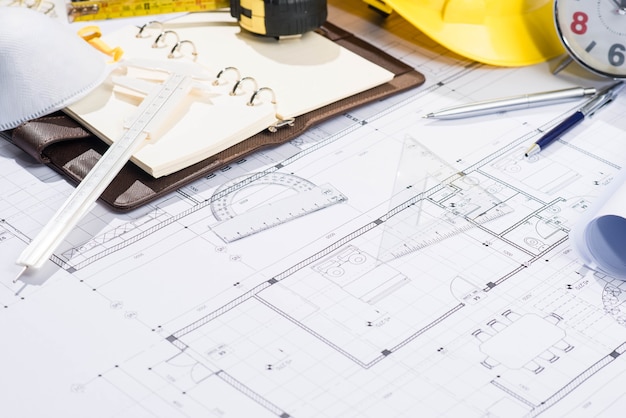 Architects workplace - architectural project with blueprints.