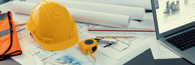 Architectural designed blueprint layout and engineer tools on table insight