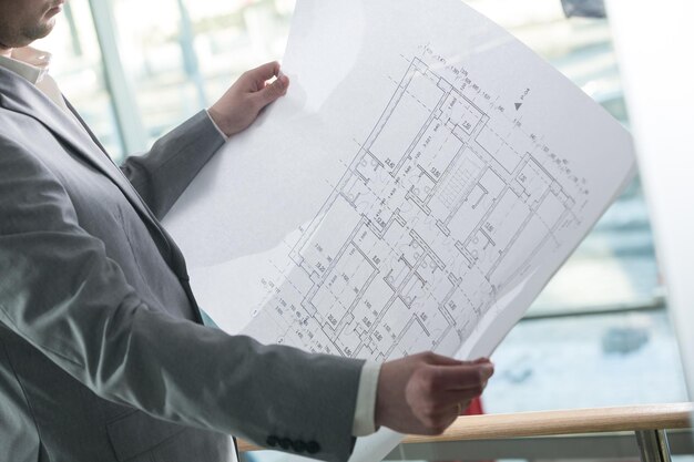 architectural plan in the hands of an architect