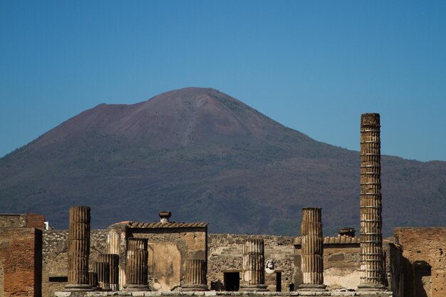 The architecture of the city of Pompeii against the backdrop of Vesuvius