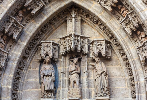 Architecture details over entrance door of Seville Cathedral (or Cathedral of Saint Mary of the See). Build in 1402-1506.