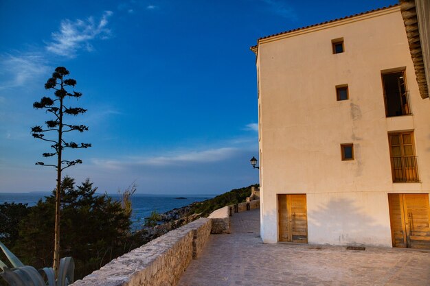 The architecture of the island of Ibiza A charming empty white street in the old town of Eivissa