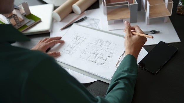 architecture man drawing on architectural creative project business architecture building construction industrial engineering achievement planning design on eco blueprint