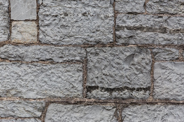 건축, 벽돌, 석조물 및 외부 개념 - 오래된 벽돌 또는 석조 벽 배경 가까이