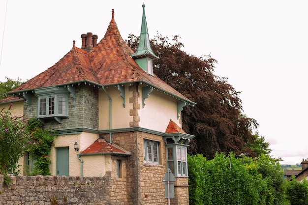 Architecture of an old house with a garden in England