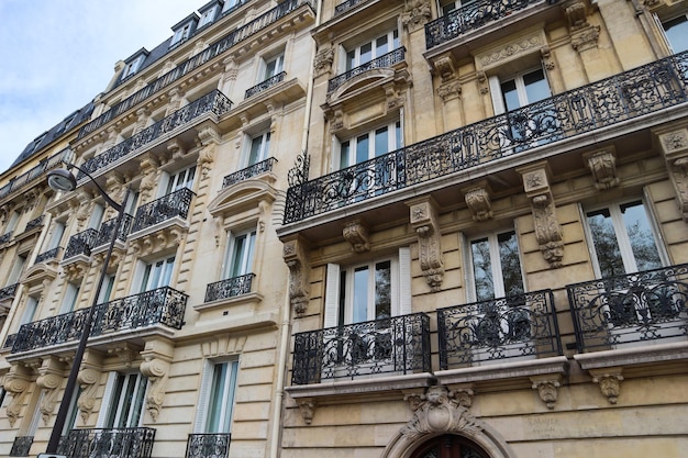 Architecture of Paris France. Facades of a traditional apartment buildings