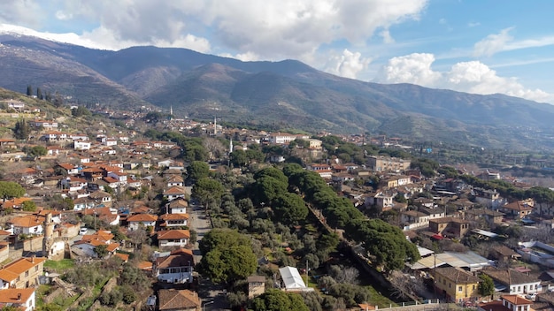 Architecture stone buildings, traditional Turkish village houses in touristic place Birgi, Izmir. Landscape with aerial drone.