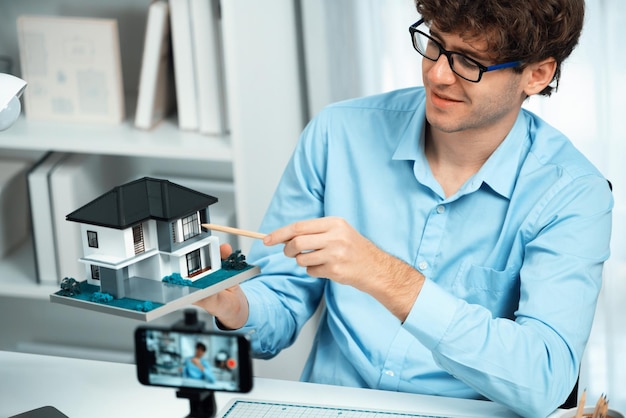 Photo architecture using house model to teach architect by smartphone gusher