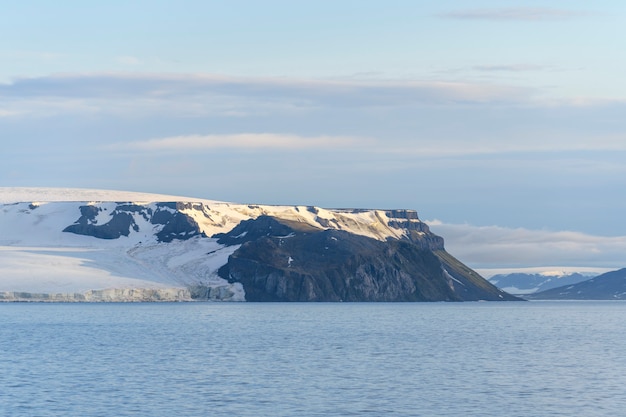 Arctic landscape in summer time. Franz Jozef Land archipelago. Flora cape, Gukera island. Rubini Rock.