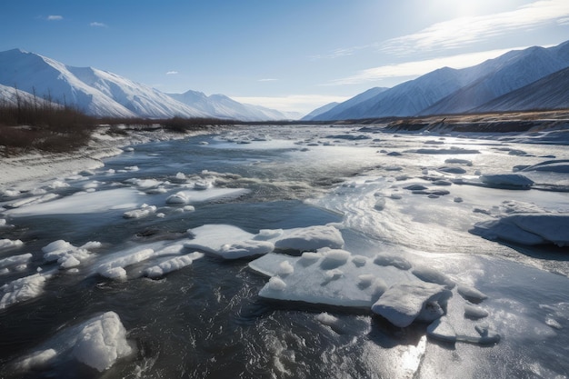 Arctic river with ice floes and mountains in the background