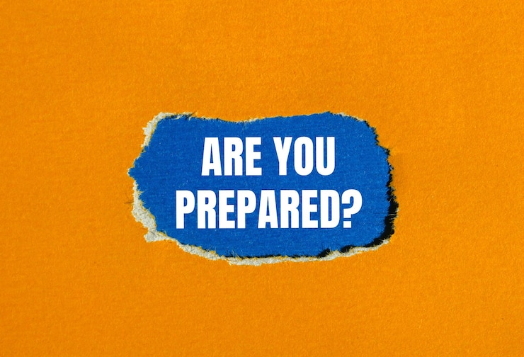 Photo are you prepared question message written on ripped torn orange paper with blue background conceptual are you prepared question symbol copy space