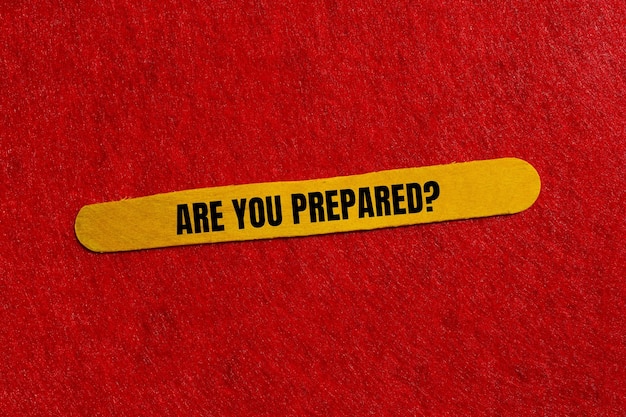 are you prepared question written on yellow wooden stick with red background conceptual are you prepared question symbol copy space