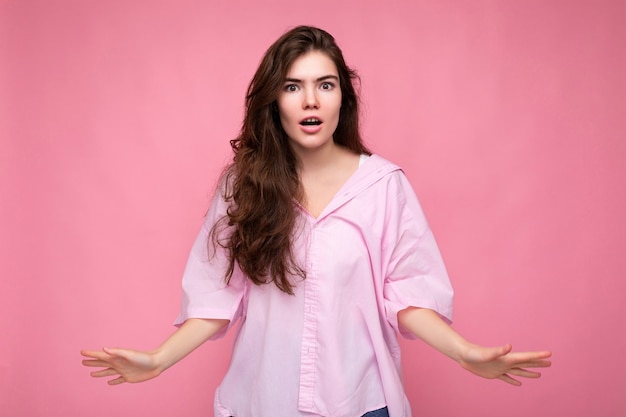 Are you serious closeup photo of beautiful attractive shocked amazed surprised young woman with open