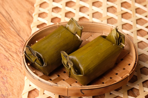 Arem-arem is an Indonesian-Javanese snack made of compressed rice cake in form of a cylinder wrap.