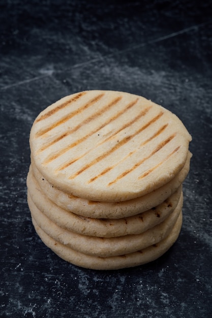 Arepas on a black background