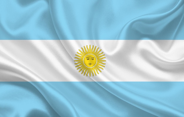 Foto bandiera del paese dell'argentina sul panorama di sfondo del tessuto di seta ondulato - illustrazione