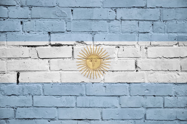 Argentina flag is painted onto an old brick wall