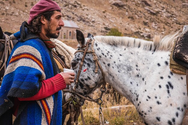 Argentine Gaucho with his horses