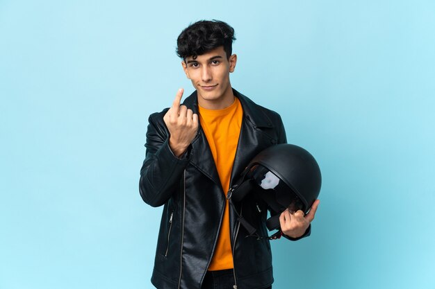 Argentinian man with a motorcycle helmet doing coming gesture