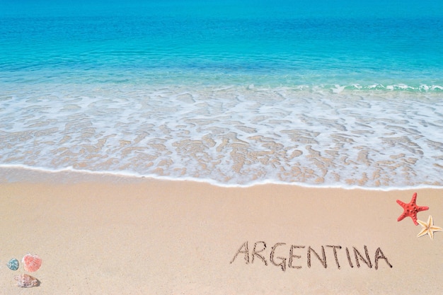 Argentinië geschreven op een tropisch strand