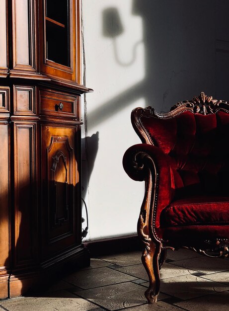 Armchair by cabinet at home