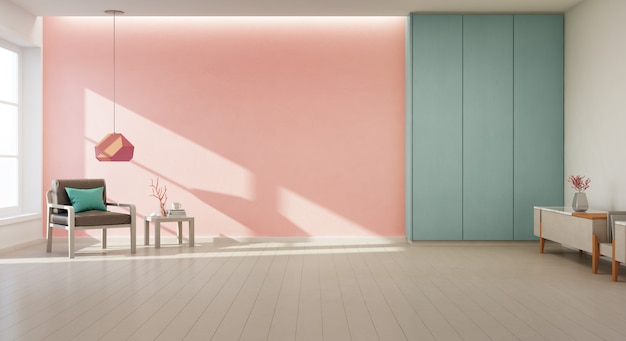 Armchair on wooden floor with window and coral concrete wall in large living room at modern new house.