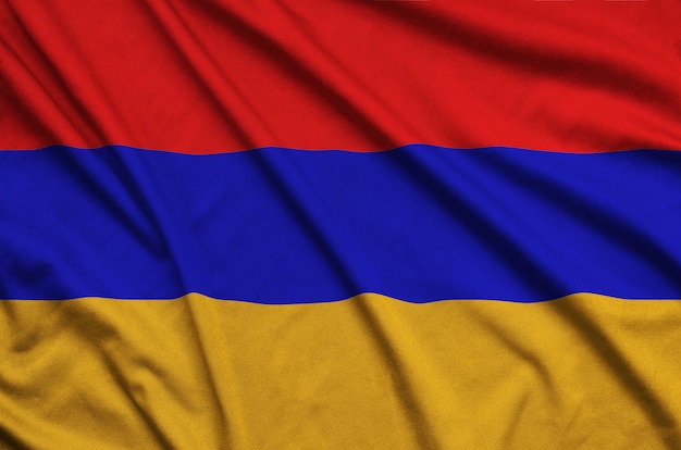 Armenia flag is depicted on a sports cloth fabric with many folds