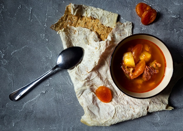 Armenian beef soup with dried apricot