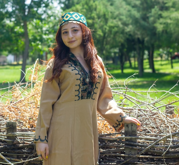 Armenian young woman in traditional clothes in the park woman with traditionnal clothes