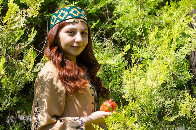 Armenian young woman in traditional clothes in the park woman with traditionnal clothes