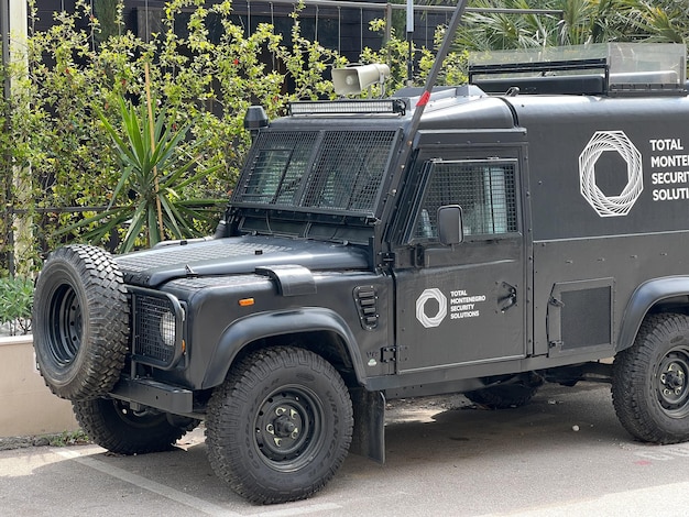 Armored suv of a security company with bars on the windows on
the street