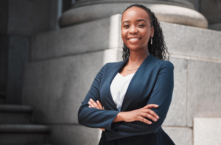 Photo arms crossed lawyer or portrait of happy black woman with smile or confidence working in a law firm confidence empowerment or proud african attorney with leadership or vision for legal agency